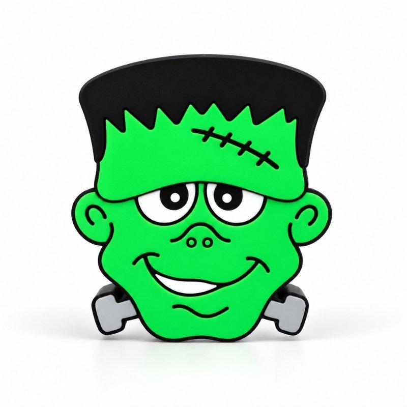Cute Frankenstein Sidekick featuring a bright green face, black hair, stitched forehead, playful smile, and gray neck bolts on a clean white background, designed for Embellish Queen personalized Namelets.