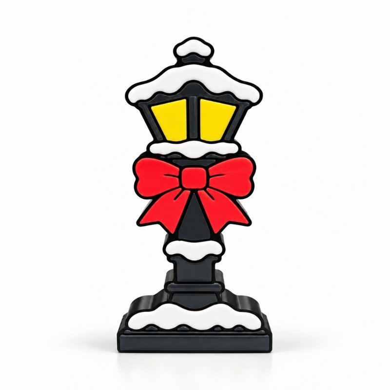 Holiday Lamp Post SideKick featuring a black Christmas street lamp with glowing yellow windows, white snow accents, and a festive red bow.