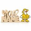 Personalized stacked Namelet desk sign in ivory with an interchangeable rainy day goose sidekick wearing a bright yellow raincoat, matching rain hat, and boots, by Embellish Queen.